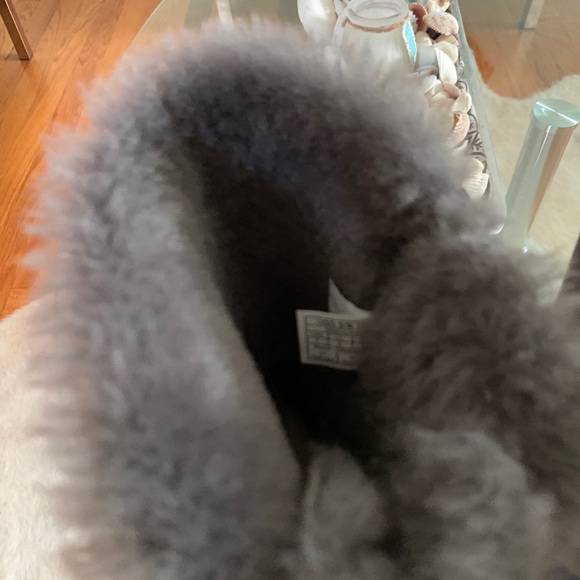 UGG Bailey Bow Boots that are a light grey color. - Picture 3 of 6